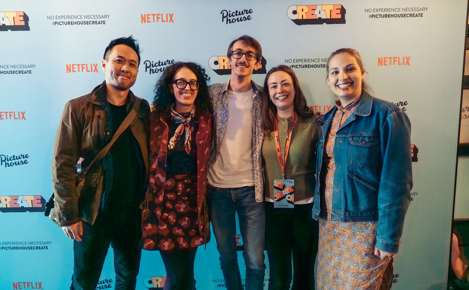Five student filmmakers smiling